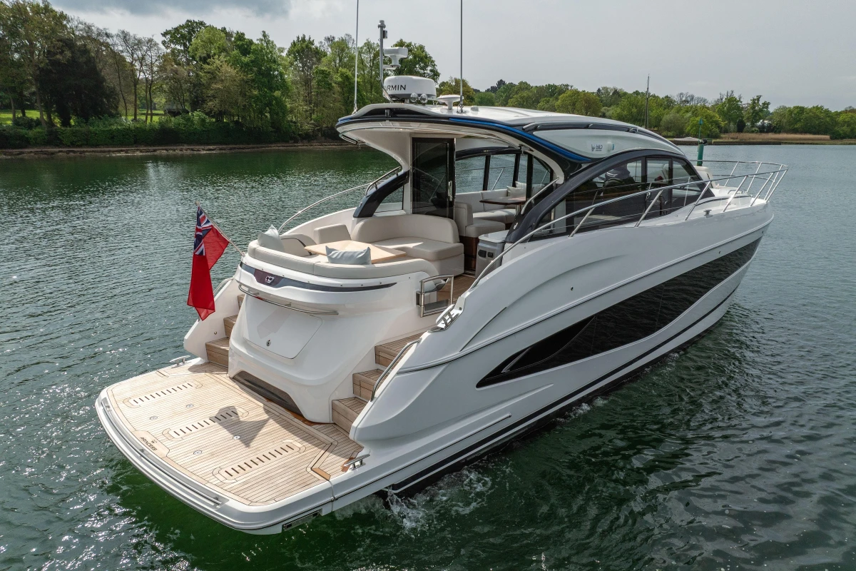 2025 Princess V50 yacht on water, sleek design, luxury features, rear view, open deck.