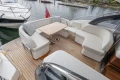 Luxury seating area on 2025 Princess V50 yacht with elegant wooden deck.
