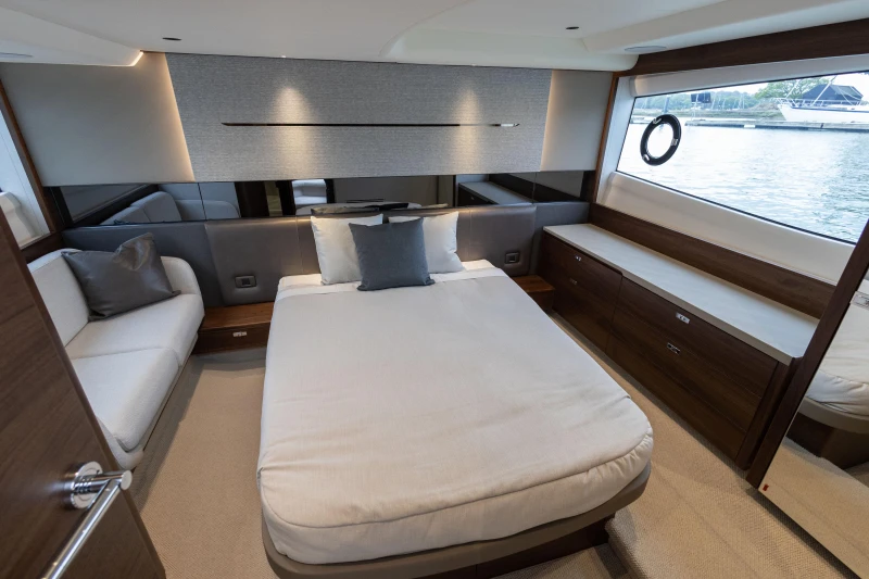 Luxurious interior of 2025 Princess V50 yacht with elegant bedroom design.