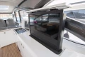Luxurious interior of 2016 Princess V58 Open yacht with modern TV and seating area.