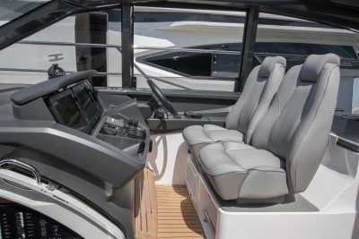2016 Princess V58 Open yacht cockpit with modern controls and plush seating.