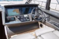 Helm of 2016 Princess V58 Open yacht with navigation screens and controls.