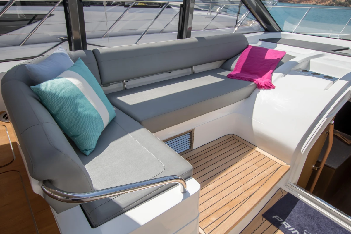 Luxurious seating area on 2016 Princess V58 Open yacht with colorful cushions.