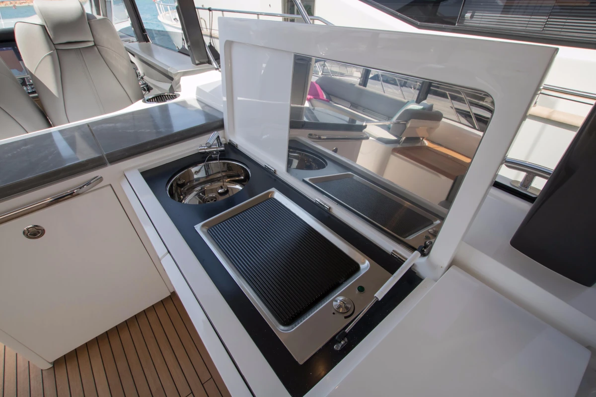 Luxury yacht Princess V58 Open 2016 with sleek onboard kitchen and grill setup.
