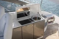 2024 Princess V40 yacht kitchenette with sink and grill on deck.