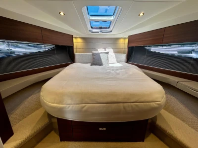 Luxurious 2024 Princess V40 yacht cabin with elegant bedding and modern design.