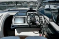 2024 Princess V40 yacht cockpit with modern navigation controls and steering wheel.