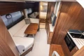 Luxurious interior of 2024 Princess V40 yacht with modern kitchen and cozy seating area.