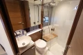 Luxurious bathroom in 2024 Princess V40 yacht with modern fixtures and wooden accents.
