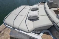 Luxurious sunbathing deck on 2025 Princess S65 yacht with plush cushions and serene water view.