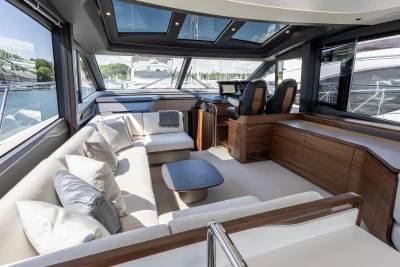 Luxurious interior of 2025 Princess S65 yacht with plush seating and modern design.
