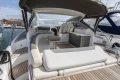 Luxurious 2018 Princess V40 yacht with elegant seating and sleek design in a marina setting.