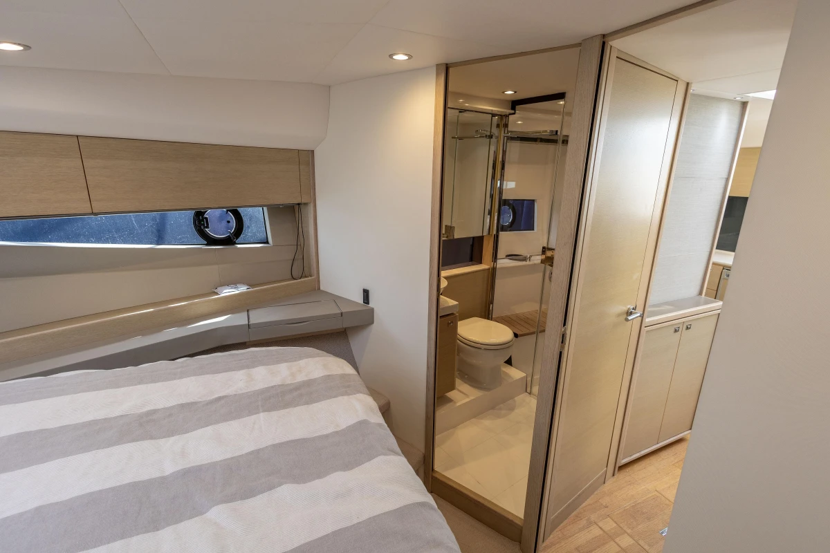 Interior of 2018 Princess V40 yacht featuring bedroom and bathroom with modern design.