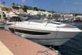 2022 Princess V40 yacht docked at a marina, clear sky, waterfront view.