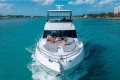 Luxury Princess F65 yacht cruising in turquoise waters, 2025 model.