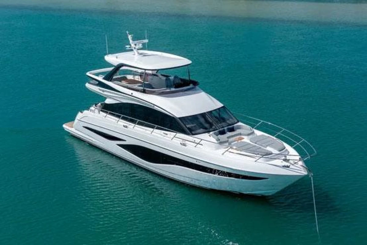 Luxurious 2025 Princess F65 yacht cruising on clear blue waters.