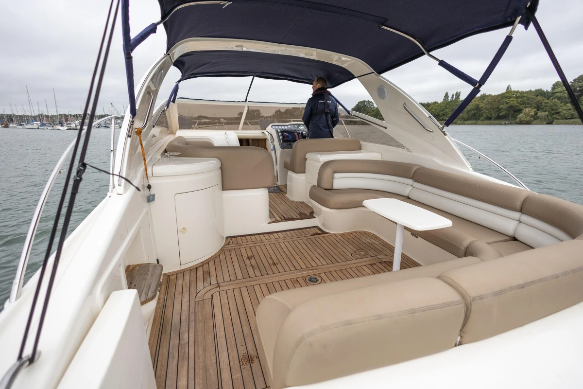 Luxury 2000 Princess V42 yacht with spacious seating and elegant design on open water.