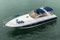 Luxury 2000 Princess V42 yacht cruising on calm waters, featuring sleek design and spacious deck.