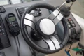 Steering wheel and controls of a 2000 Princess V42 yacht cockpit.