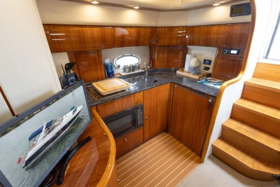 Luxurious 2000 Princess V42 yacht interior with modern kitchen and entertainment area.