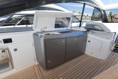 2024 Princess V50 Open yacht interior with sleek kitchenette and modern design.