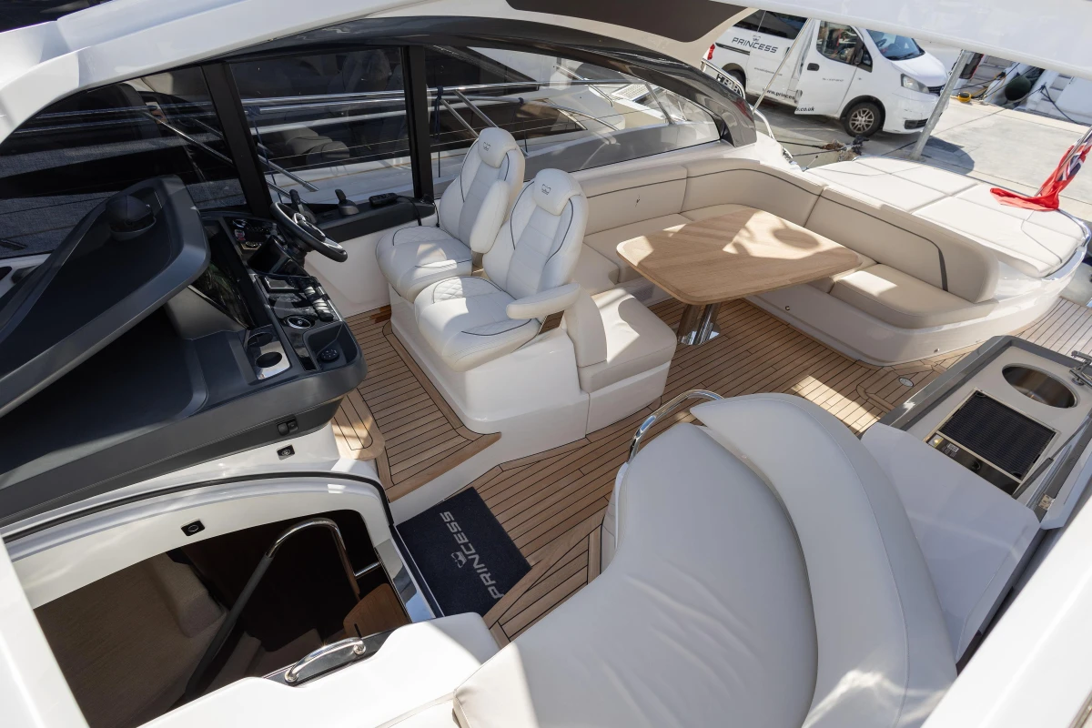 Luxurious 2024 Princess V50 Open yacht interior with elegant seating and modern helm.
