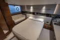 Luxurious bedroom interior of 2024 Princess V50 Open yacht with modern design.
