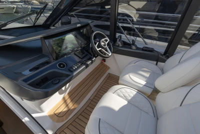 2024 Princess V50 Open yacht cockpit with modern controls and luxurious seating.