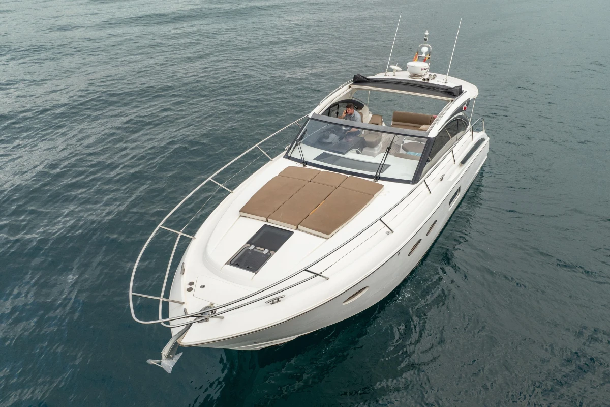2014 Princess V39 yacht cruising on calm waters, featuring sleek design and spacious deck.