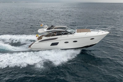 2014 Princess V39 yacht cruising on open water, showcasing sleek design and performance.