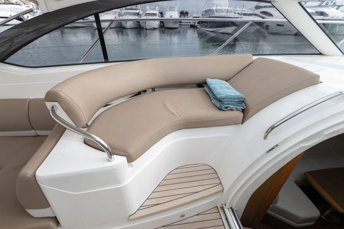 Luxurious seating area on a 2014 Princess V39 yacht with a folded towel.
