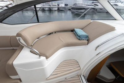 Luxurious seating area on a 2014 Princess V39 yacht with a folded towel.