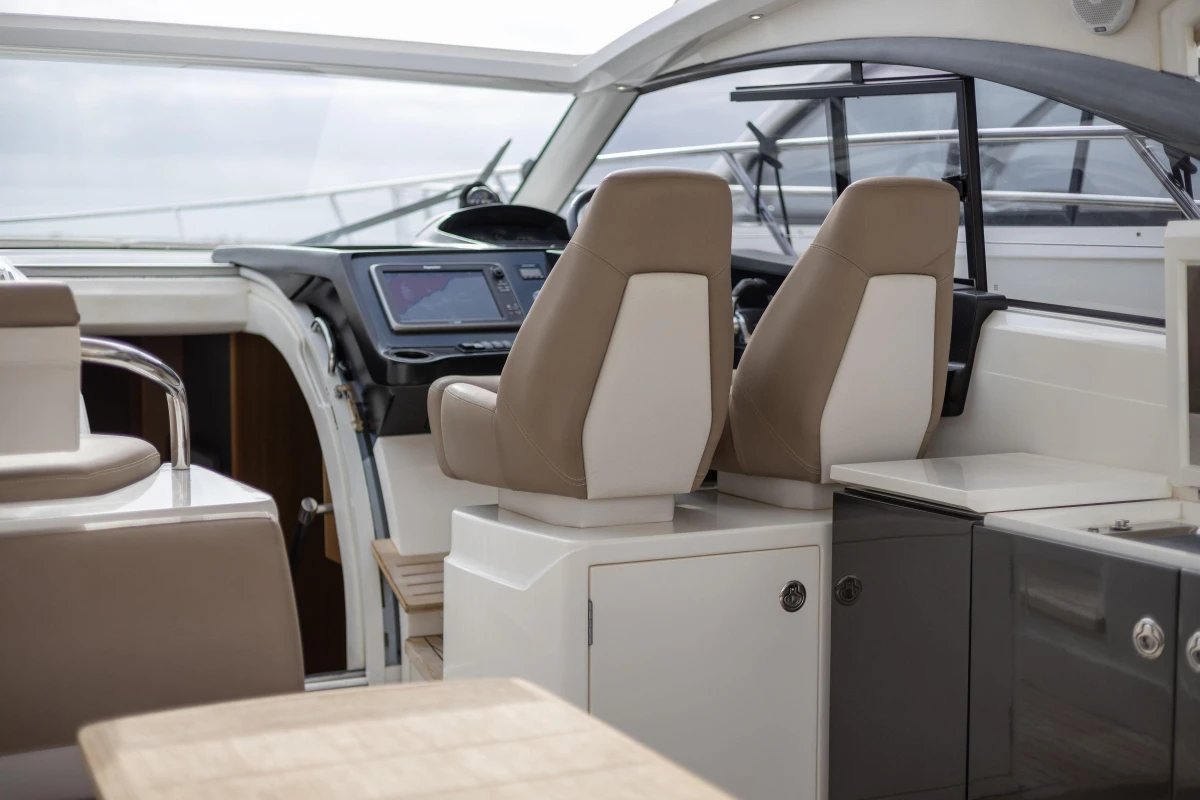 Interior view of 2014 Princess V39 yacht cockpit with modern seating and controls.