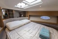 Luxurious cabin interior of 2014 Princess V39 yacht with bed and porthole.