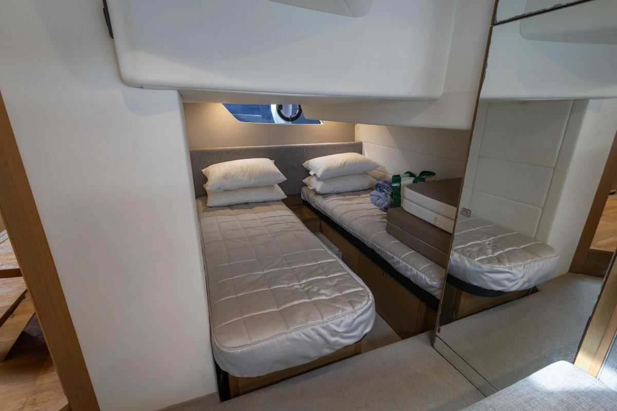 2014 Princess V39 yacht cabin with twin beds and modern interior design.