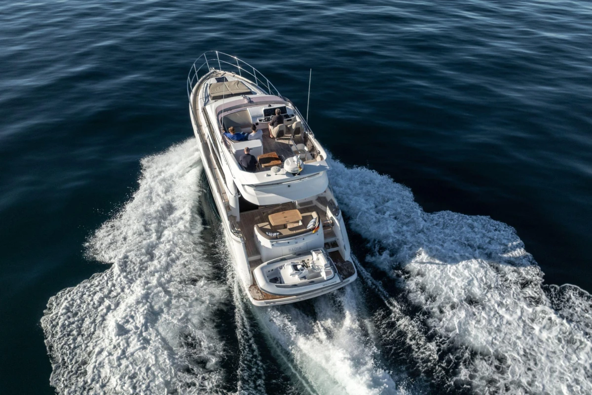 2017 Princess 49 yacht cruising on open water, aerial view.