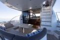 Luxurious 2017 Princess 49 yacht interior with seating, table, and stairs.