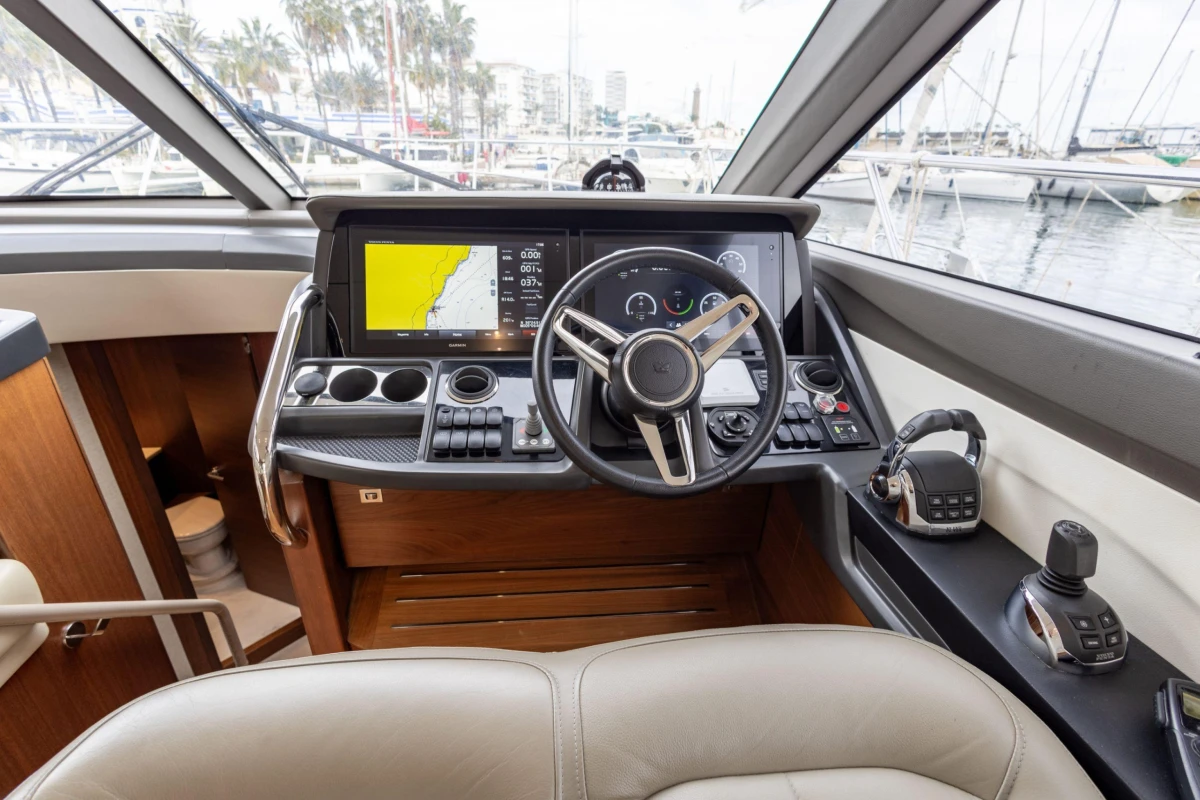 Luxurious 2017 Princess 49 yacht cockpit with advanced navigation controls and leather seating.