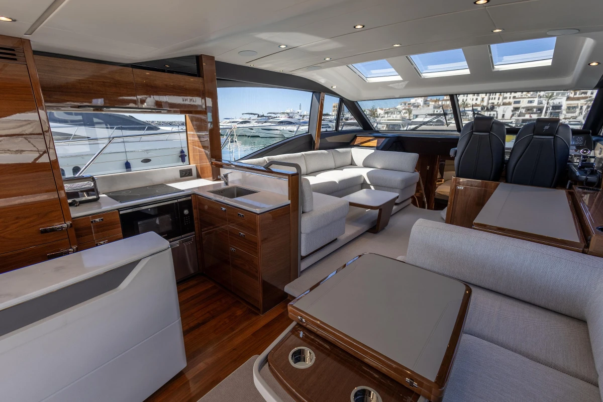 Luxurious interior of 2023 Princess S62 yacht with modern furnishings and panoramic windows.