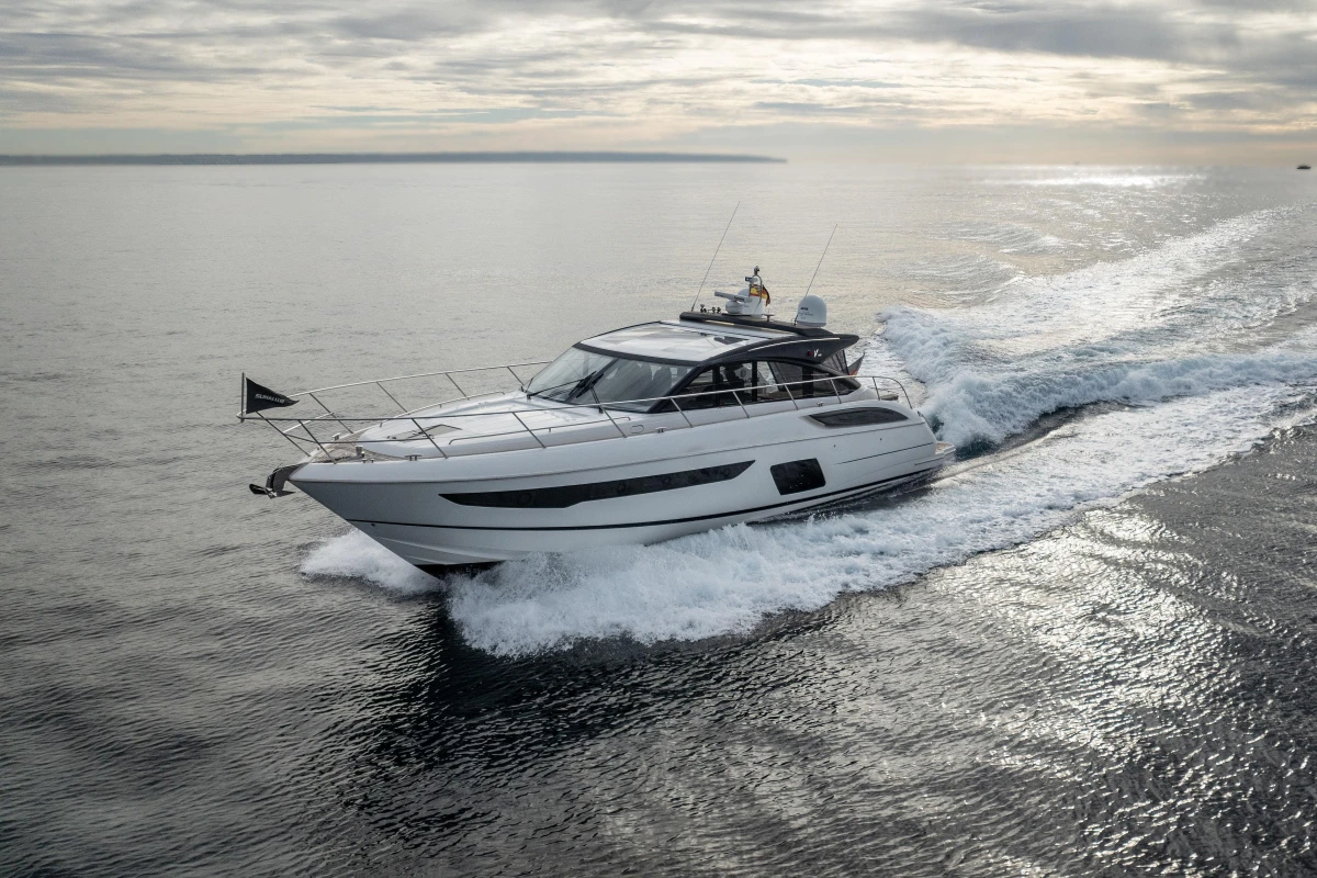 2016 Princess V58 Open yacht cruising on open water under cloudy skies.