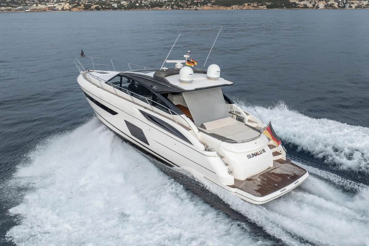 2016 Princess V58 Open yacht cruising on open water, rear view.