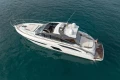 2016 Princess V58 Open yacht cruising on clear blue water.