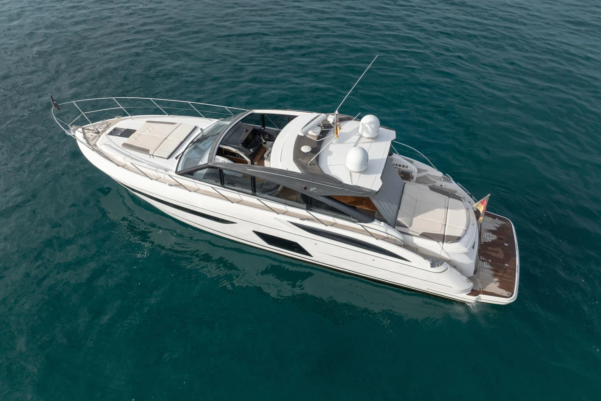2016 Princess V58 Open yacht cruising on clear blue water.
