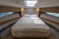 Luxurious bedroom interior of 2019 Princess V40 yacht with skylight and modern design.