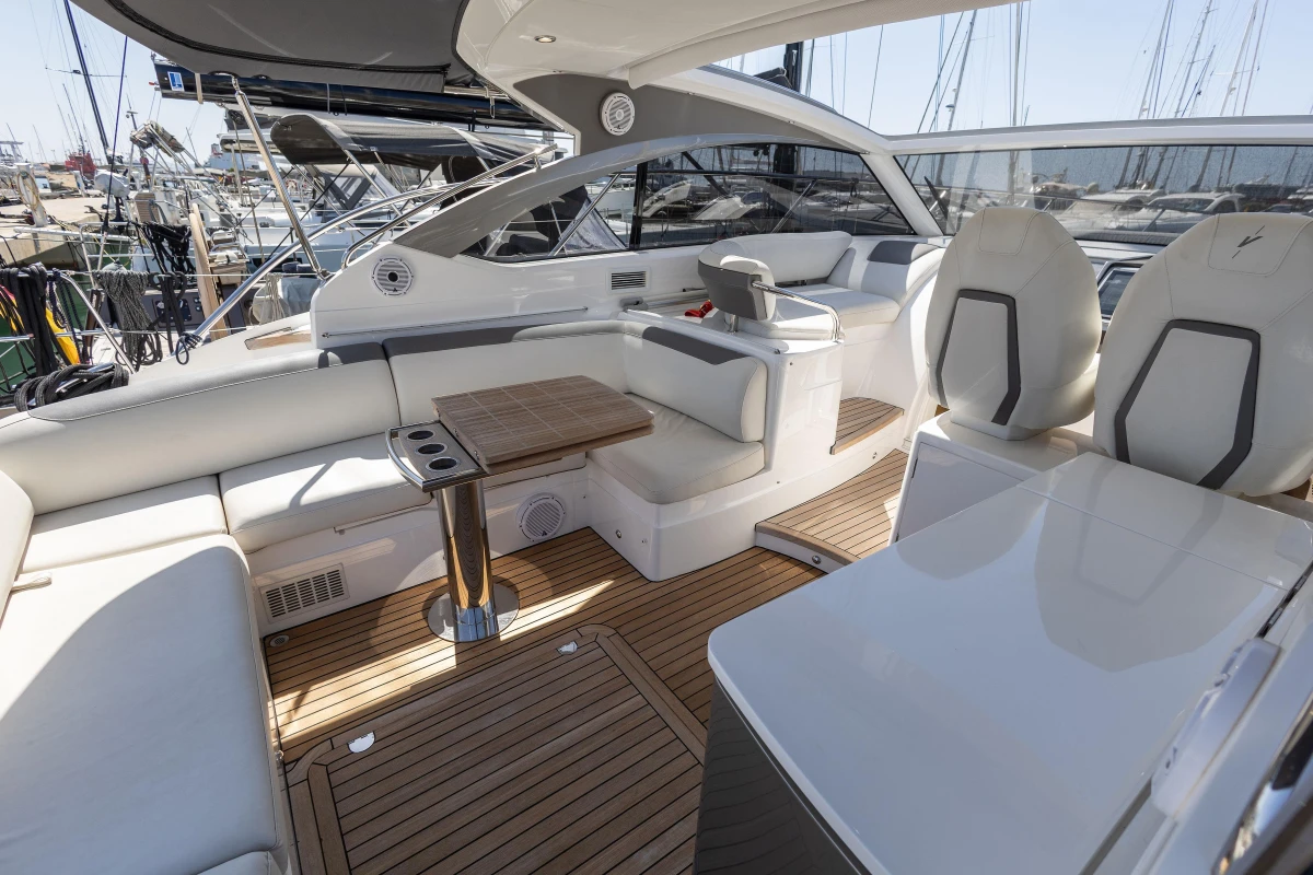 Luxurious 2019 Princess V40 yacht interior with elegant seating and wooden flooring.