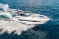 2019 Princess V40 yacht cruising on open sea, creating dynamic water splashes.