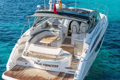 Luxurious 2019 Princess V40 yacht on clear blue water, featuring elegant deck seating.