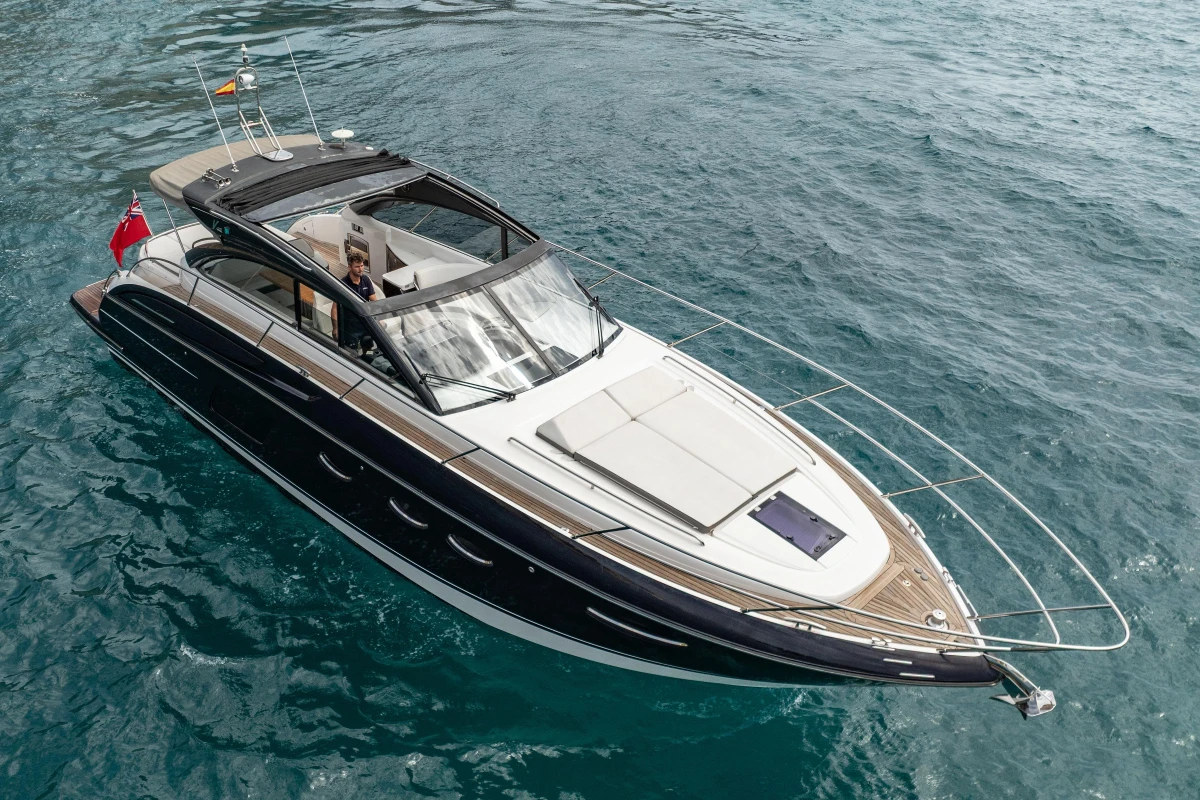 2017 Princess V48 Open yacht cruising on clear blue water.