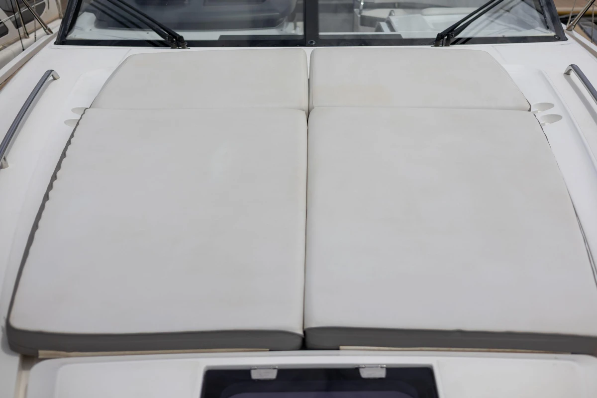 2017 Princess V48 Open yacht with cushioned sunbathing area on deck.