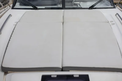 2017 Princess V48 Open yacht with cushioned sunbathing area on deck.